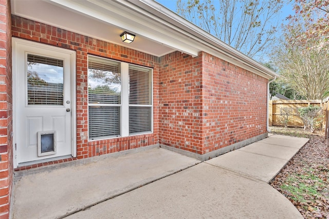 entrance to property with a patio area