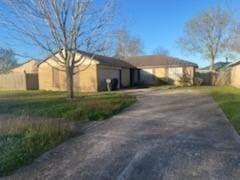 view of side of home with a yard