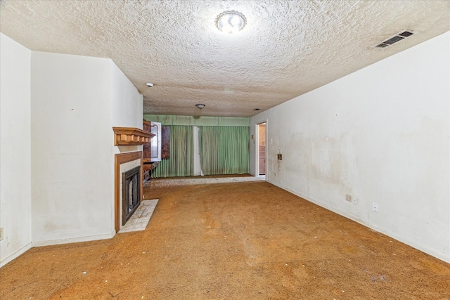 unfurnished living room with a textured ceiling