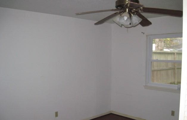 spare room with ceiling fan