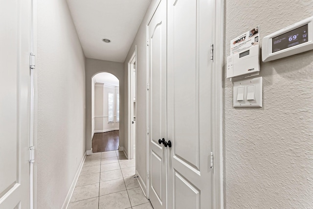 hallway with light tile patterned floors