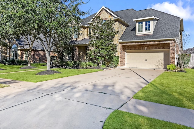 view of front of home featuring a garage and a front lawn