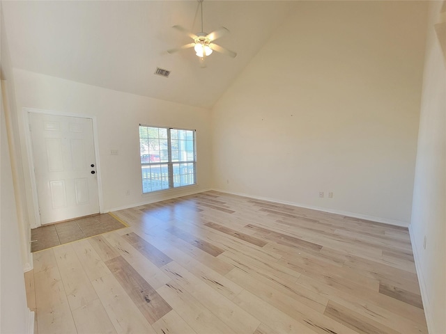 unfurnished room featuring light wood-type flooring, high vaulted ceiling, and ceiling fan