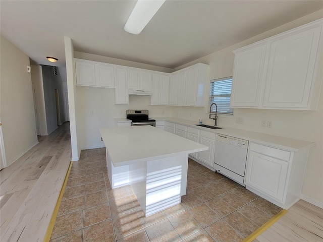 kitchen with white cabinetry, dishwasher, sink, electric stove, and a kitchen island