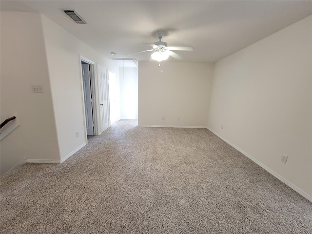 carpeted empty room featuring ceiling fan