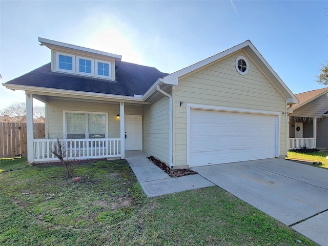 view of front of home with a front yard, a porch, and a garage