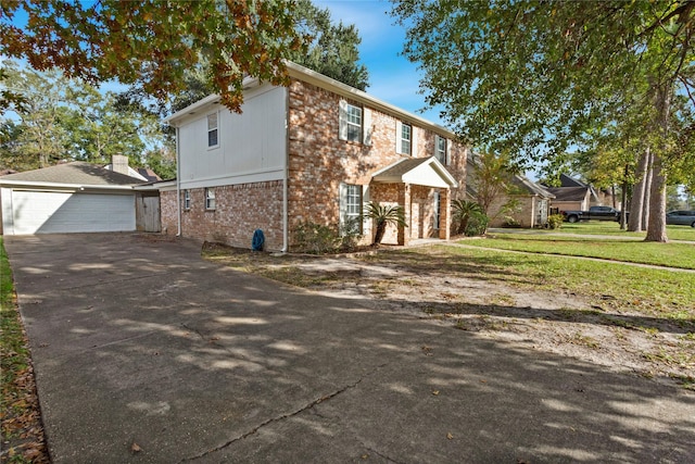 view of front of home featuring a garage and a front lawn