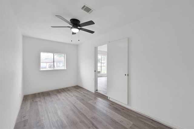 spare room featuring ceiling fan and light wood-type flooring