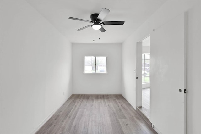 empty room featuring light hardwood / wood-style flooring and ceiling fan