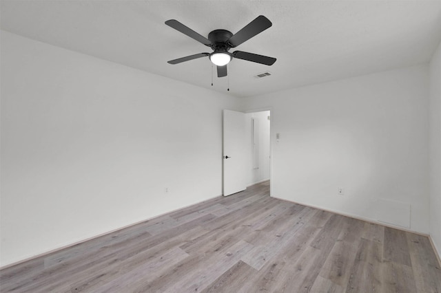 unfurnished room featuring ceiling fan and light wood-type flooring