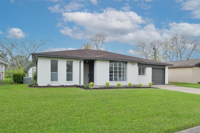 ranch-style home with a front lawn, central AC unit, and a garage