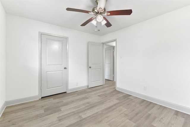 unfurnished bedroom featuring ceiling fan and light hardwood / wood-style floors