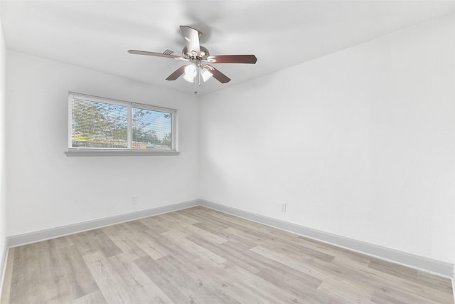 spare room featuring ceiling fan and light hardwood / wood-style flooring