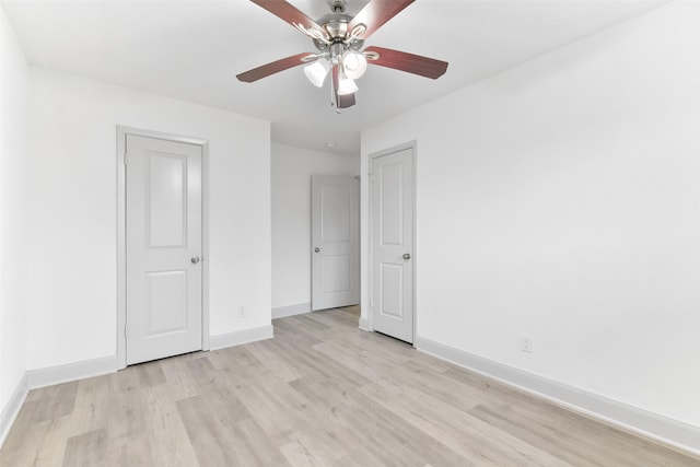 unfurnished bedroom featuring ceiling fan and light hardwood / wood-style floors