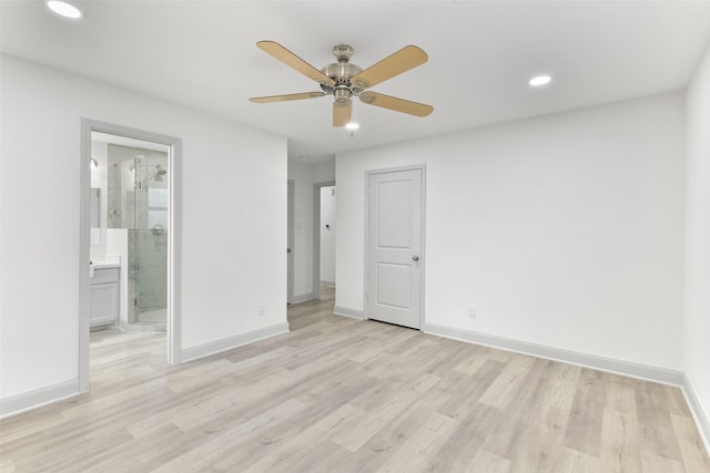 spare room featuring ceiling fan and light hardwood / wood-style floors