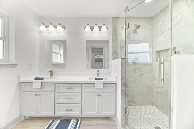 bathroom featuring hardwood / wood-style floors, vanity, a healthy amount of sunlight, and an enclosed shower