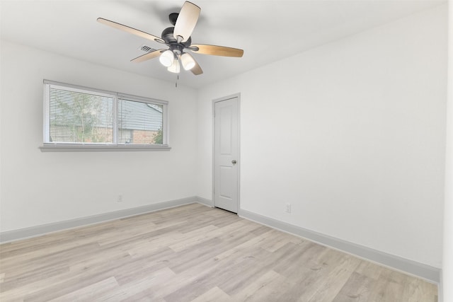 empty room with light hardwood / wood-style floors and ceiling fan