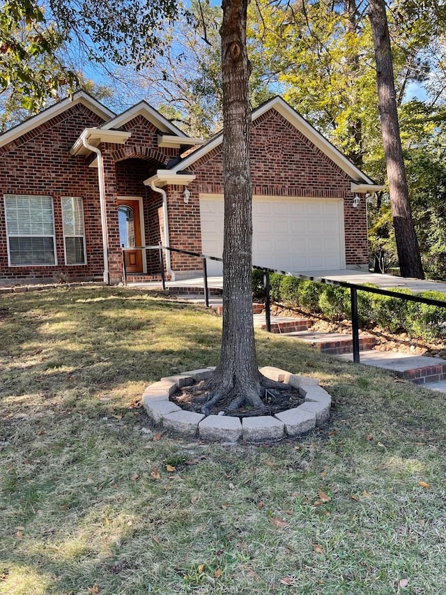 view of front of house featuring a front lawn and a garage