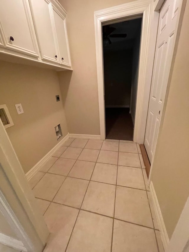 laundry room with washer hookup, light tile patterned flooring, cabinets, and hookup for an electric dryer