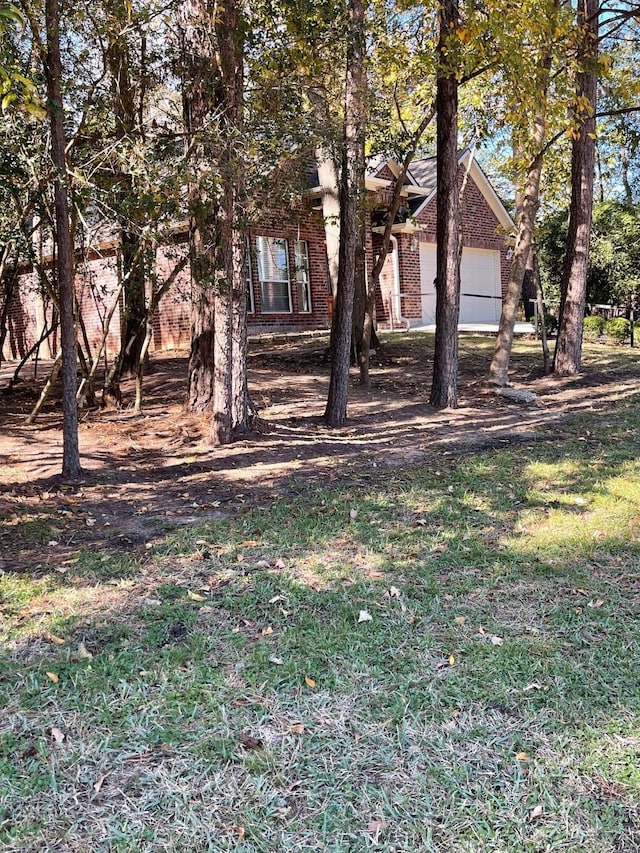 view of yard with a garage