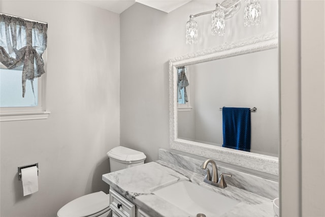 bathroom with vanity and toilet