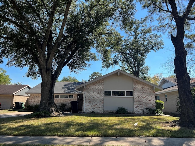 ranch-style house with a front lawn