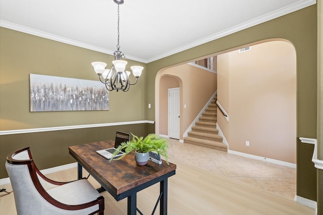 dining area with an inviting chandelier, ornamental molding, and light tile patterned floors