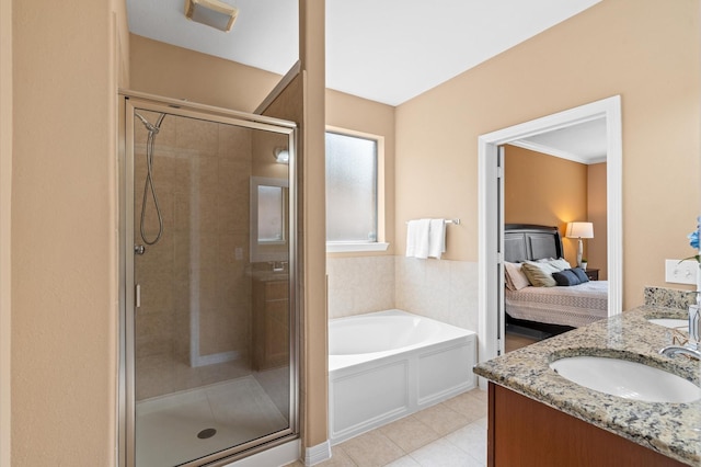 bathroom with vanity, ornamental molding, and separate shower and tub