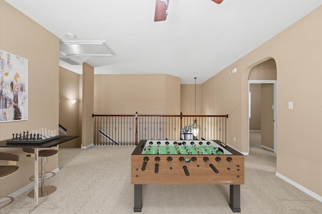 game room featuring light carpet