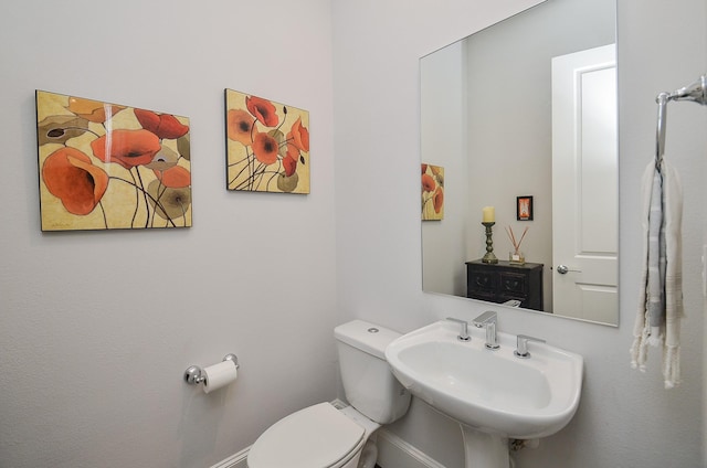 bathroom featuring sink and toilet