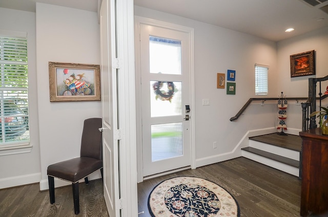 foyer entrance with dark hardwood / wood-style floors