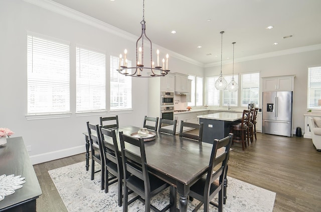 dining space with a healthy amount of sunlight, dark hardwood / wood-style flooring, and ornamental molding