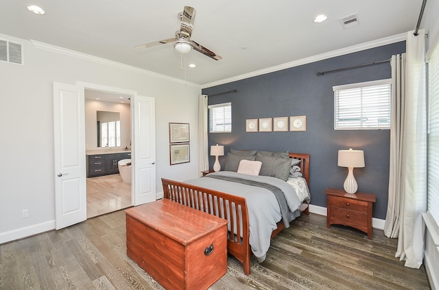 bedroom featuring wood-type flooring, connected bathroom, ceiling fan, and ornamental molding