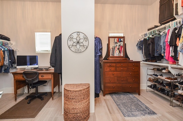 walk in closet featuring light wood-type flooring