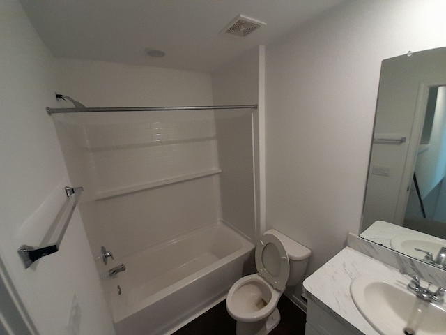 full bathroom featuring toilet, vanity, and tub / shower combination