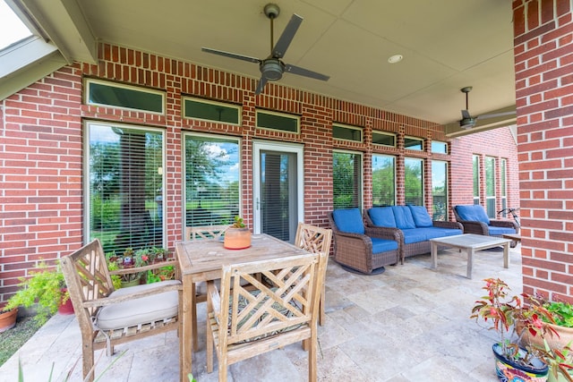 view of patio with an outdoor living space and ceiling fan