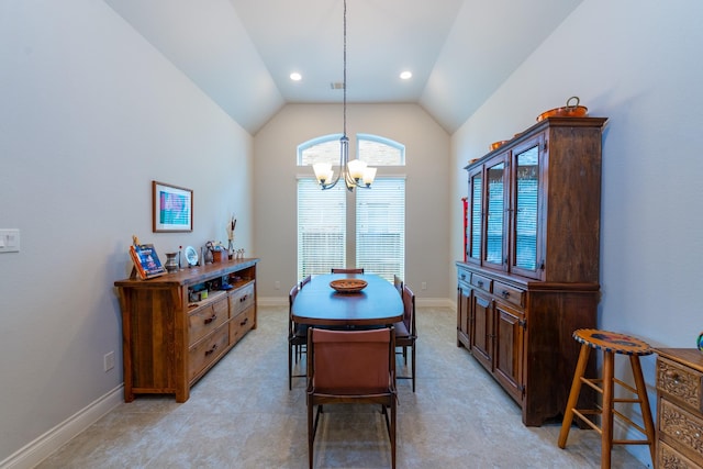 dining room with an inviting chandelier and lofted ceiling