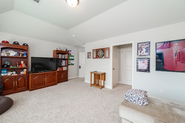 living room featuring light colored carpet and vaulted ceiling