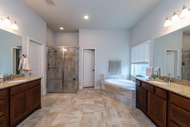 bathroom with vanity and plus walk in shower