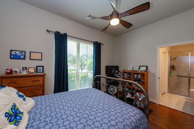 bedroom with ceiling fan and dark hardwood / wood-style floors