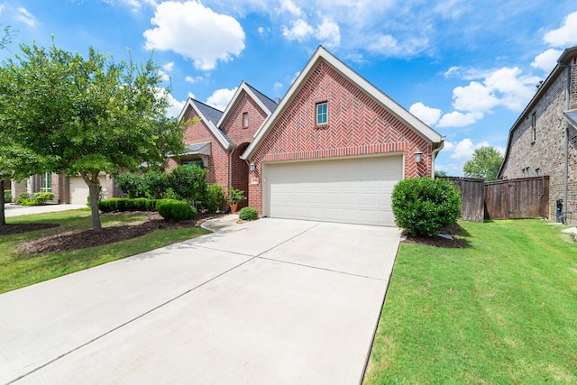 view of front of house with a front yard and a garage