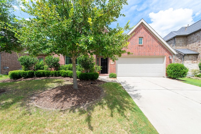 view of property hidden behind natural elements with concrete driveway, brick siding, and a front lawn
