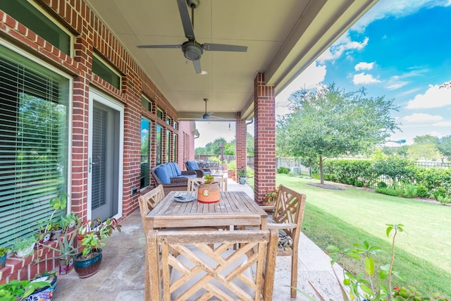 view of patio featuring fence and ceiling fan