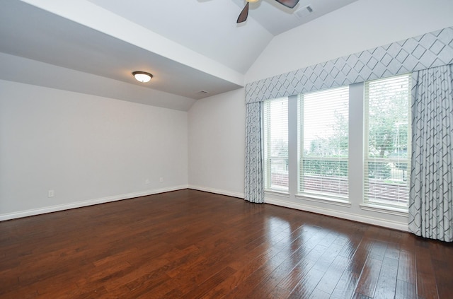 spare room featuring visible vents, ceiling fan, wood-type flooring, and vaulted ceiling