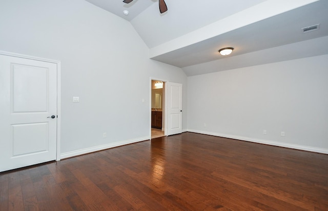 spare room with dark wood-style flooring, baseboards, a ceiling fan, and vaulted ceiling