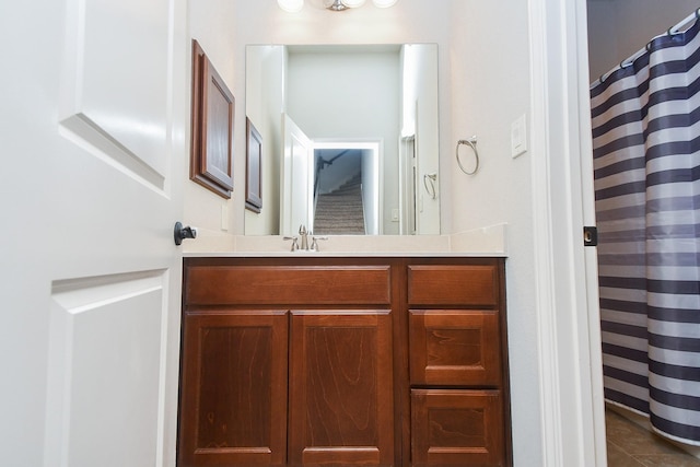 full bath featuring vanity, tile patterned flooring, and a shower with curtain