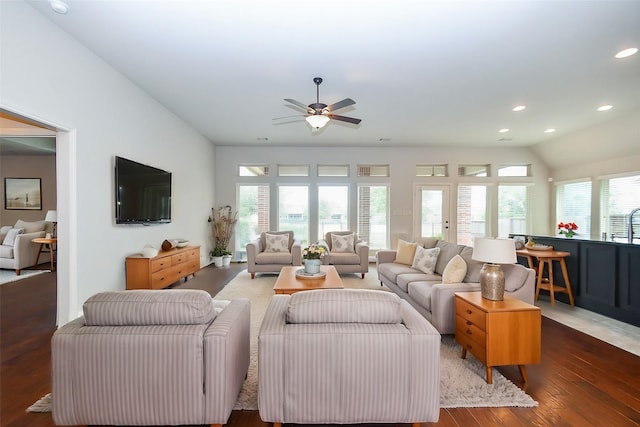 living room featuring ceiling fan, lofted ceiling, and dark hardwood / wood-style floors