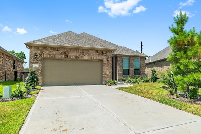 view of front of house with a front lawn and a garage