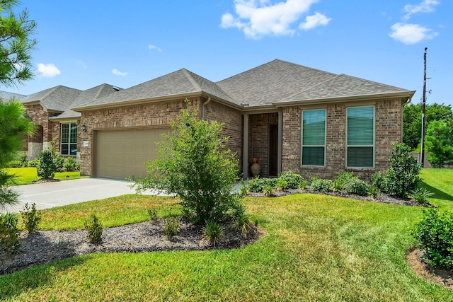 view of front of house featuring a garage and a front lawn