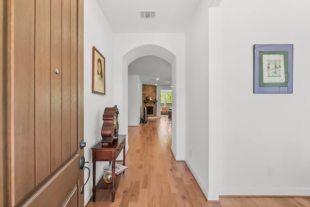 hallway with light hardwood / wood-style flooring